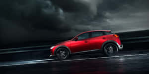 Mazda C X3 Red Driving Rainy Weather Wallpaper