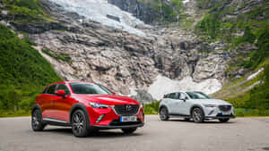 Mazda C X3 Redand Grey Models Mountain Backdrop Wallpaper