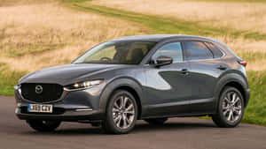 Mazda Cx-30 Driving On A Scenic Road Wallpaper