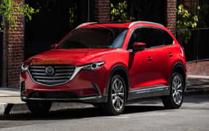 Mazda Cx-9: An Eye-catching Beauty On The Road Wallpaper