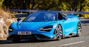 Mclaren 765lt Unleashing Its Power On The Track Wallpaper