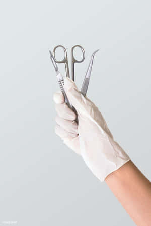 Medical Instrumentsin Hand Wallpaper