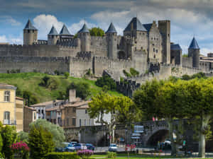 Medieval Fortified City With Chateau Comtal In Carcassonne Wallpaper