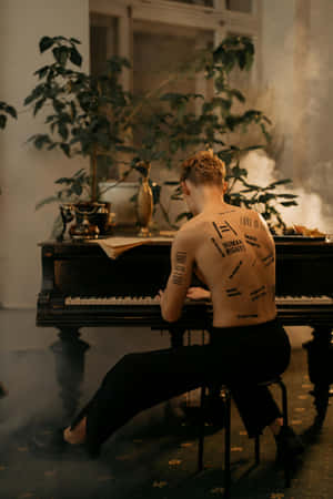 Melancholic_ Melodies_ Back_ Tattoo_ Piano Wallpaper