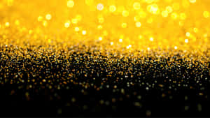 Mesmerizing Black And Gold Glitter Wallpaper Wallpaper