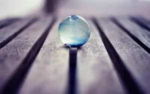 Mesmerizing Crystal Ball On Dark Background Wallpaper