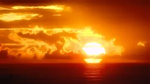 Mesmerizing Orange Sunset Over The Horizon Wallpaper