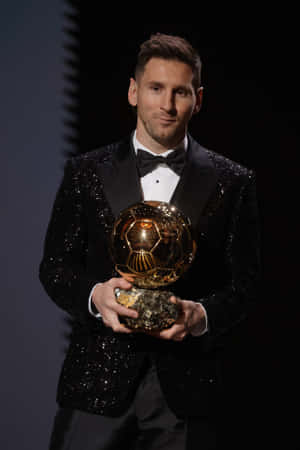 Messi Holding Ballon Dor Award Wallpaper