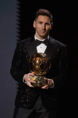Messi Holding Ballon Dor Award Wallpaper
