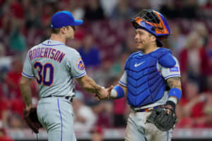 Mets Pitcherand Catcher Celebration Wallpaper