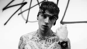 Mgk Performing On Stage Wallpaper