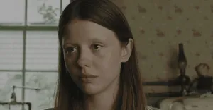 Mia Goth Serious Expression Wallpaper