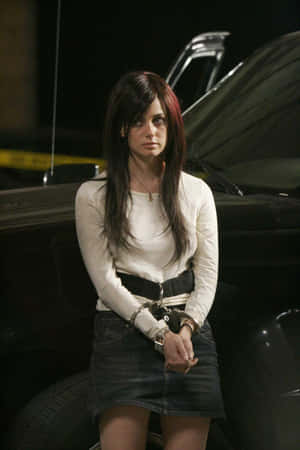 Mia Kirshner Handcuffed Character Scene Wallpaper