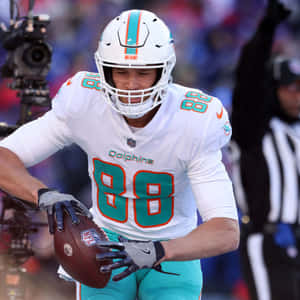 Miami Dolphins Player Catching Football Wallpaper