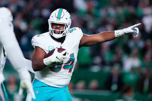 Miami Dolphins Player In Action Wallpaper