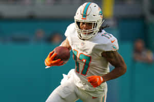 Miami Dolphins Player In Action.jpg Wallpaper