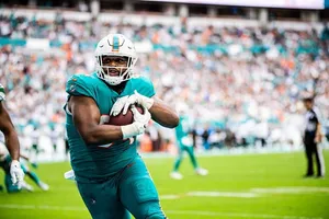 Miami Dolphins Player In Action Wallpaper