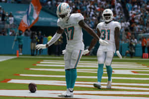 Miami Dolphins Players Celebrating Touchdown Wallpaper