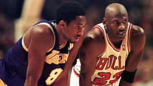 Michael Jordan And Kobe Bryant – Competitive Greats Wallpaper