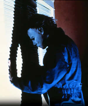 Michael Myers Peering Through Blinds Wallpaper