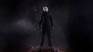 Michael Myers Standingin Dark Forest Wallpaper