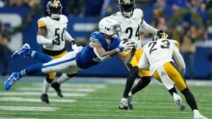 Michael Pittman Jr Catching Football Game Action Wallpaper