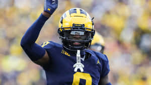 Michigan Football Player Celebrating Wallpaper