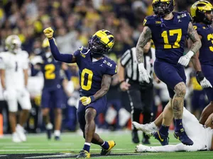 Michigan Football Player Celebration Wallpaper