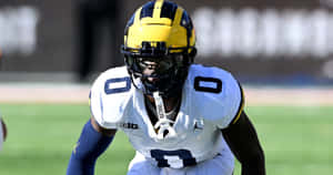 Michigan Football Player Ready For Action Wallpaper