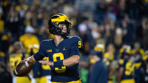 Michigan Quarterback Pre Throw Pose Wallpaper