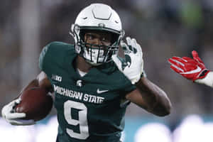 Michigan State Football Player Action Shot Wallpaper
