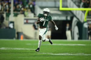 Michigan State Football Player Running Action Wallpaper