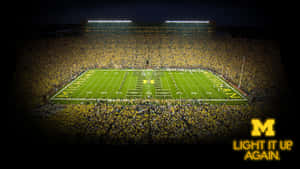 Michigan Wolverines Football Team Charging On The Field Wallpaper