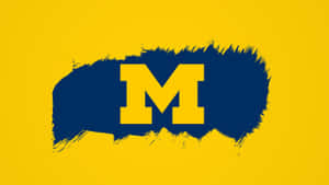 Michigan Wolverines Football Team In Action Wallpaper