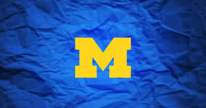 Michigan Wolverines Football Team In Action Wallpaper