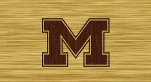 Michigan Wolverines Football Team On The Field During A Game Wallpaper