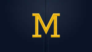 Michigan Wolverines Logo On A Football Field Wallpaper