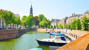 Middelburg Canal Viewwith Boatsand Tower Wallpaper