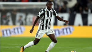 Midfielder Blaise Matuidi Kicking The Ball Wallpaper