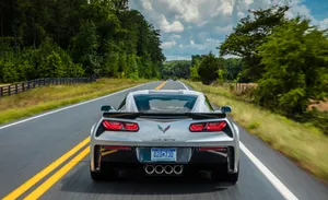 Mighty Chevrolet Corvette C7 In Action Wallpaper