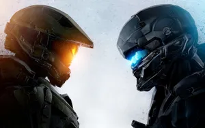 Mighty Halo Spartans In Battle-ready Stance Wallpaper