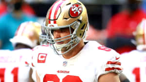 Mike Mcglinchey In Action During A Football Game Wallpaper