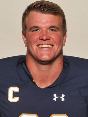 Mike Mcglinchey In Action On The Football Field Wallpaper