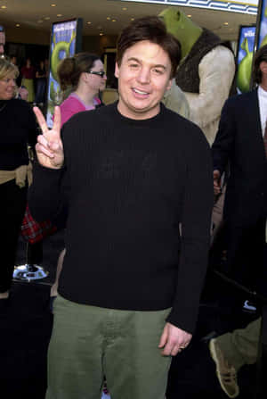 Mike Myers Striking A Charismatic Pose Wallpaper