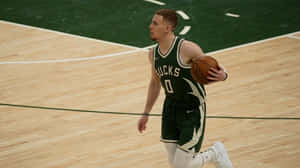 Milwaukee Bucks Player In Action Wallpaper