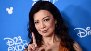 Ming Na Wen Radiant In A Black Ensemble Wallpaper