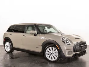 Mini Cooper S Clubman All4 In Silver On A Scenic Road Wallpaper