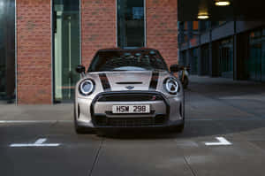 Mini Cooper S Cruising Through The City Streets Wallpaper