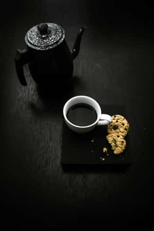 Minimalist Black Tea Setupwith Cookies.jpg Wallpaper