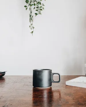 Minimalist Coffee In A Sleek White Mug Wallpaper